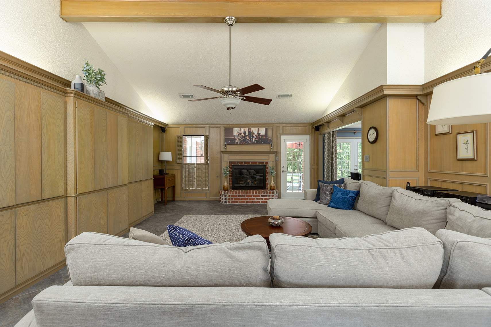 Living-room-with-custom-wood-cabinets-and-paneling