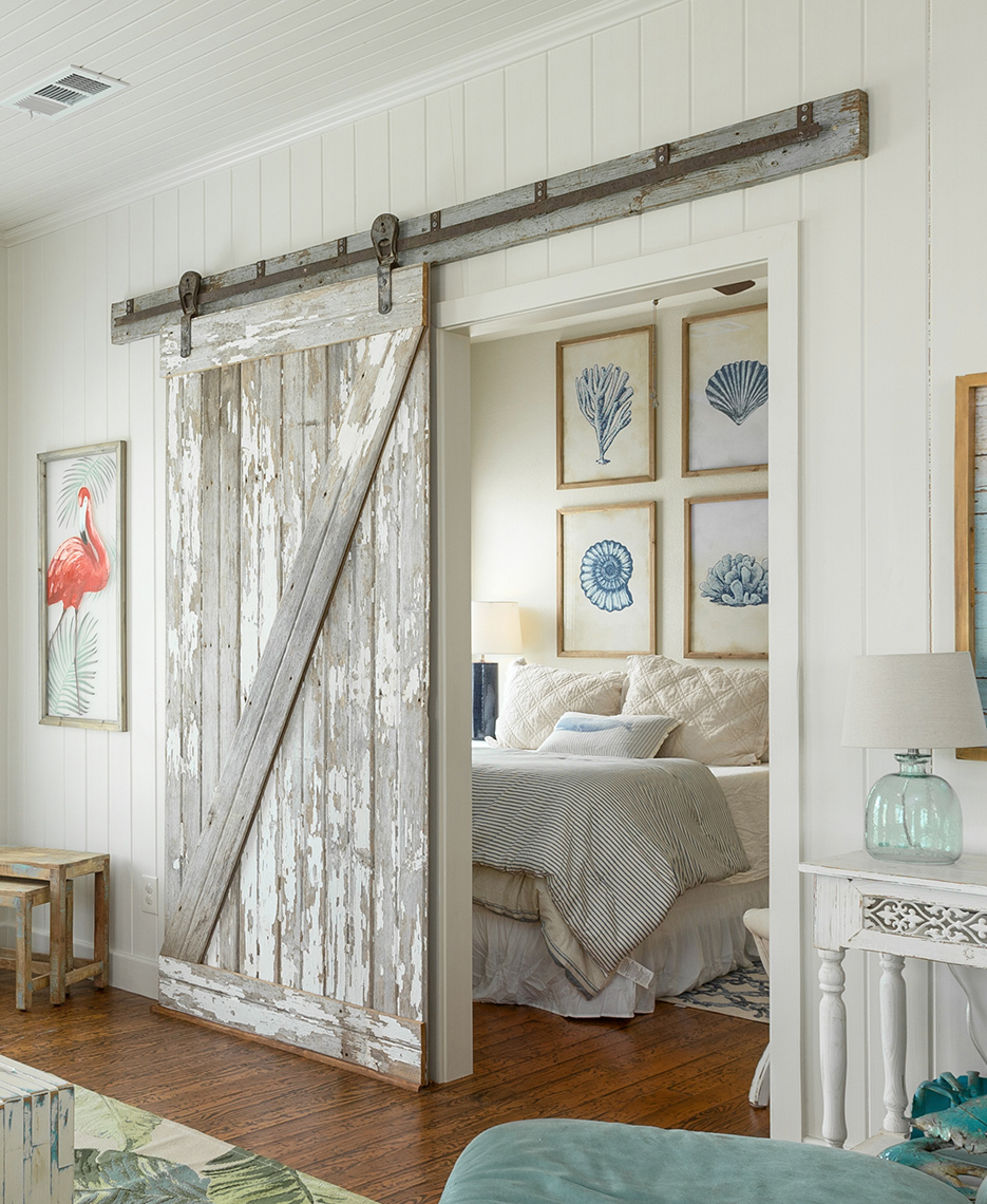 Barn-door-guest-bedroom-in-vacation-home-located-in-Crystal-Beach-architectural-photography